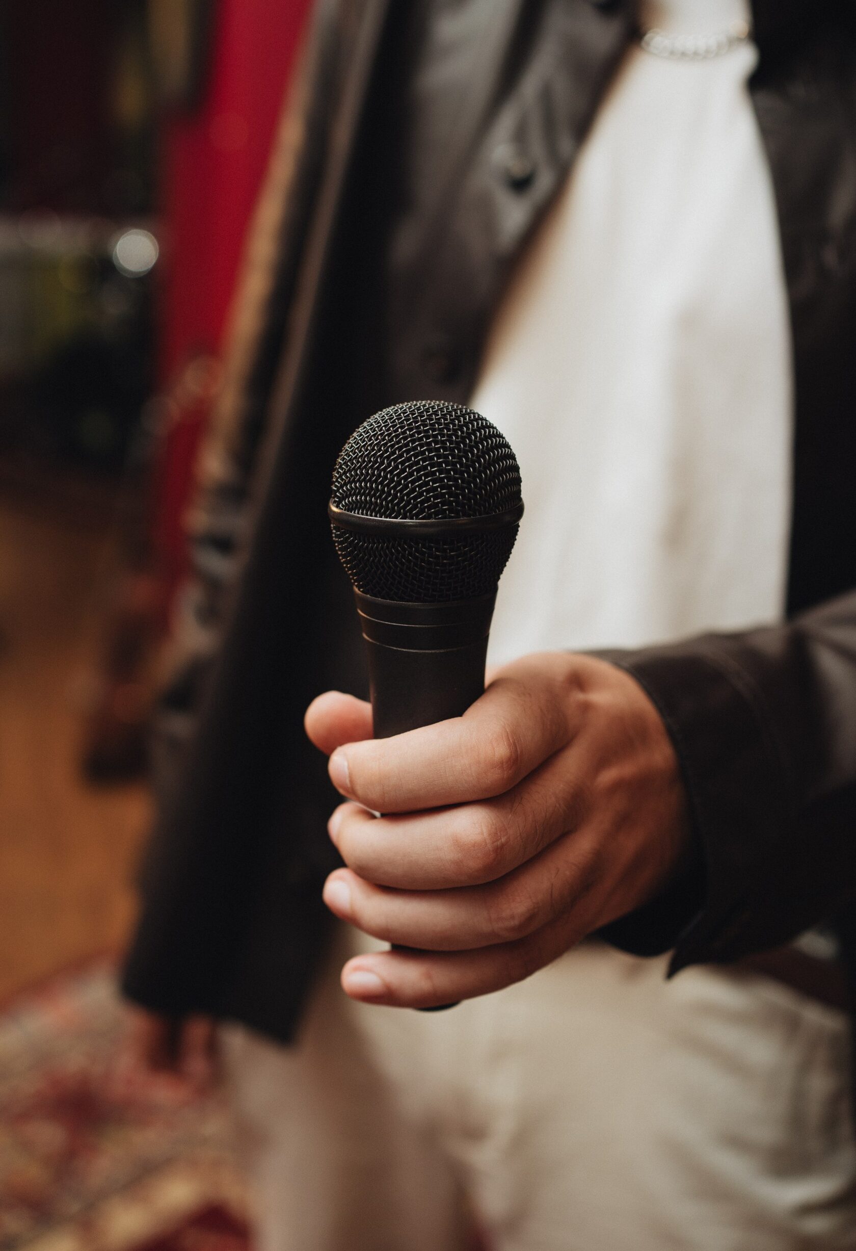 Hand holding microphone